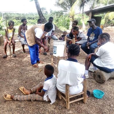 Showing villagers the method of washing hands